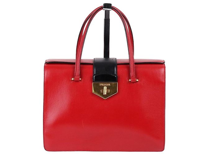 Prada Bolsa tote de couro vermelho com detalhes em dourado