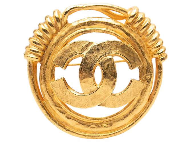Broche redondo CC dorado de Chanel