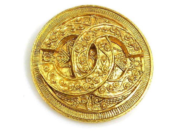 Broche en métal doré Chanel Coco Mark