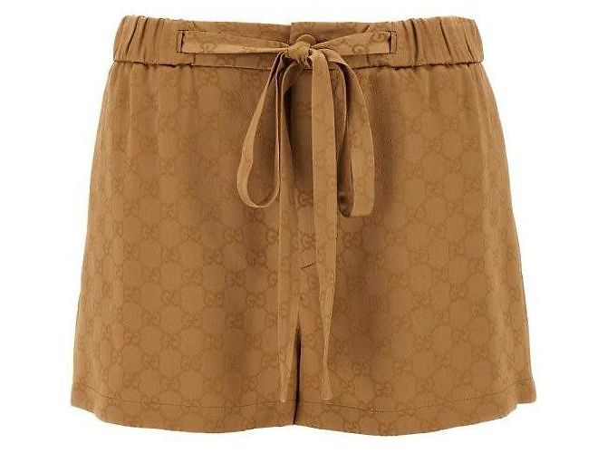 Gucci Shorts de cetim Dourado