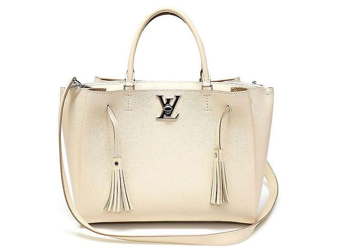 Twist Louis Vuitton Tote Tassel em Couro Beje Creme com Fecho Prateado Lockme Marrom