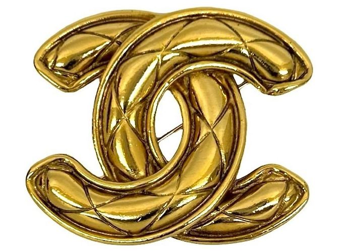 Broche banhada a ouro com motivo Coco Mark da Chanel