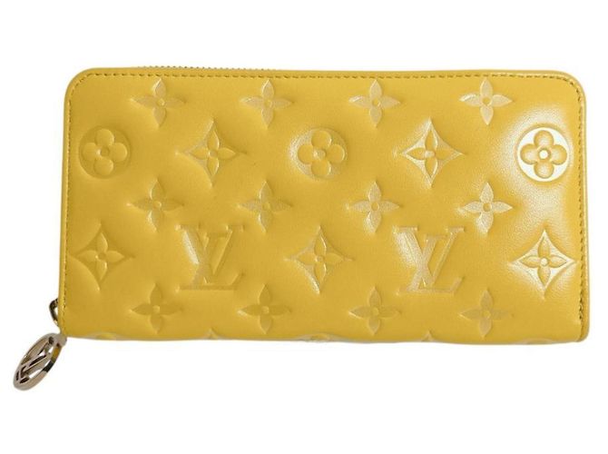 Cartera Zippy Monogram Empreinte Louis Vuitton Amarillo