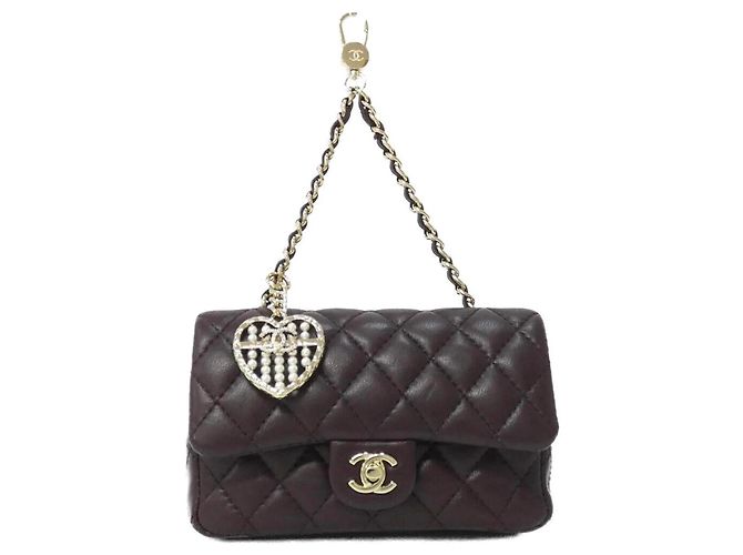 Charm per borsa Chanel in marrone e oro D'oro