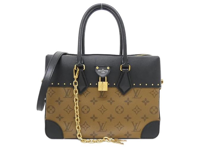 Bolsa City Malle Monogram Reverse Louis Vuitton Marrom