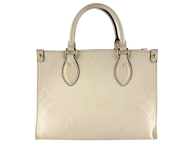 Bolsa On-the-Go PM em Monogram Empreinte Louis Vuitton Cru