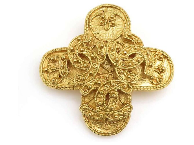Broche de metal dorado Coco Mark de CHANEL