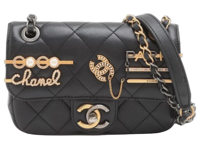 Bolsa clássica de couro matelassê preto Chanel Mini Coco Clips