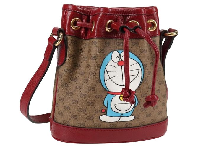 Bolsa de colaboração GUCCI Micro GG Supreme Doraemon em PVC bege e dourado Auth 132450SAM