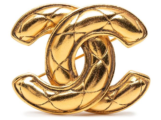 Broche CHANEL Matelassé Coco Mark em design dourado