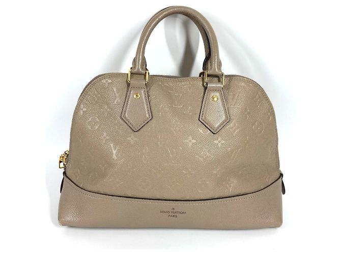 LOUIS VUITTON Bolsa Tote Neo Alma PM em Monogram Empreinte Bege