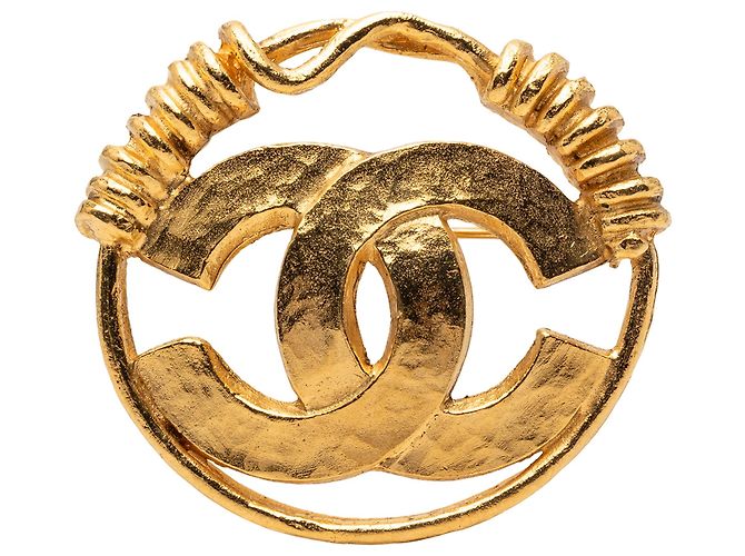 Broche redondo CC dorado de Chanel