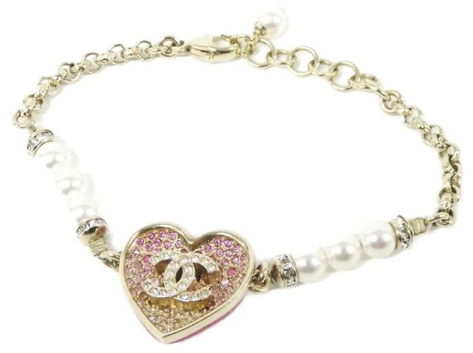 Pulseira charm Chanel em ouro, rosa e branco Dourado