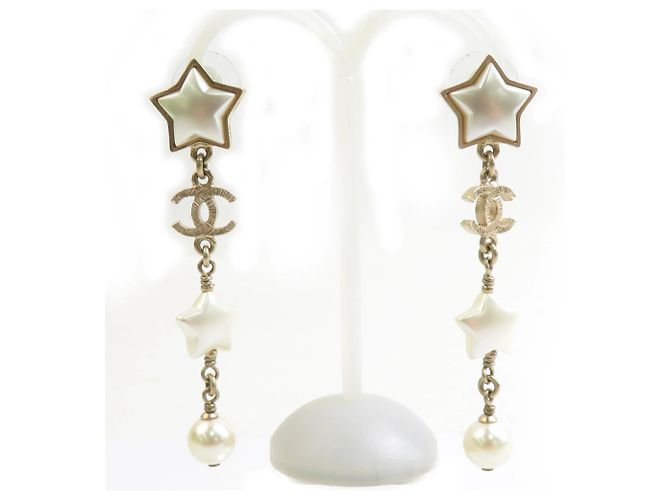 Brincos pendentes Chanel em ouro e branco Dourado