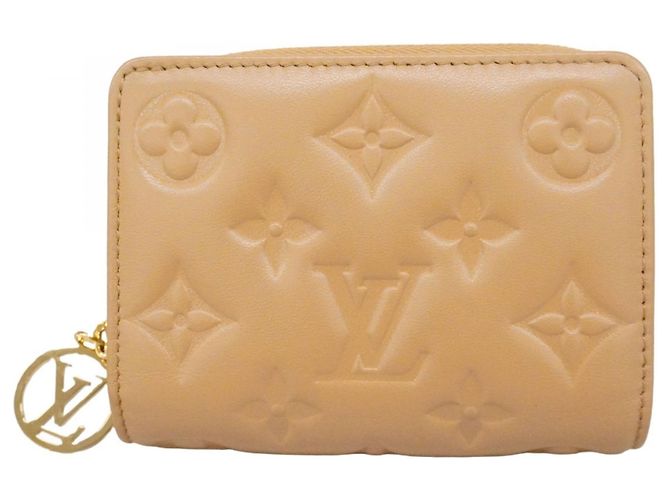 Coussin Cartera Lou de cuero Monogram grabado Louis Vuitton Camello