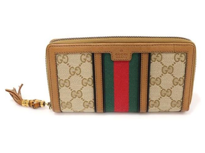 Bamboo Gucci Carteira longa com zíper Rania em bambu com jacquard de logo GG e tassel WEB Marrom