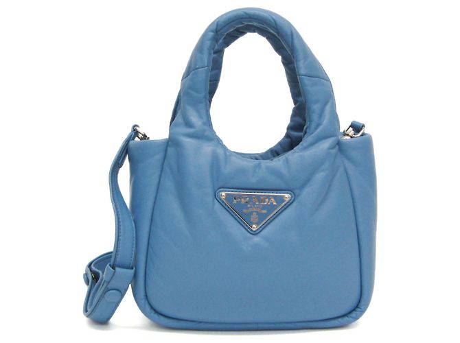 Bolsa de mão/ombro em couro nappa acolchoado 1BA359 para mulheres da Prada Azul