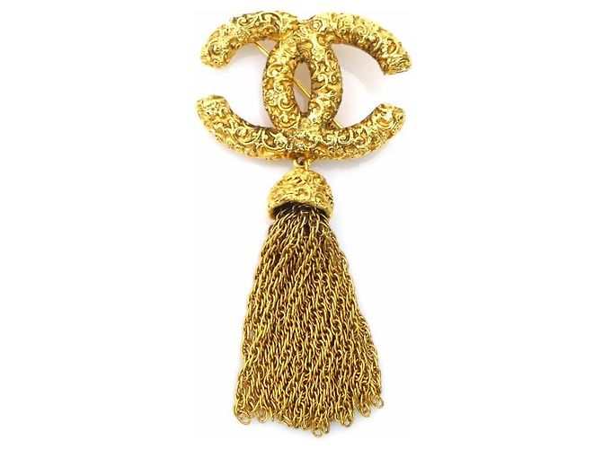 Broche de metal dorado Chanel