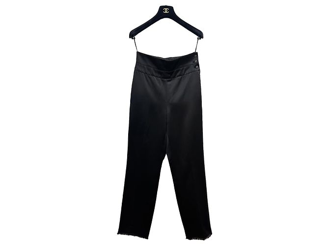 Pantalones negros Chanel con flecos