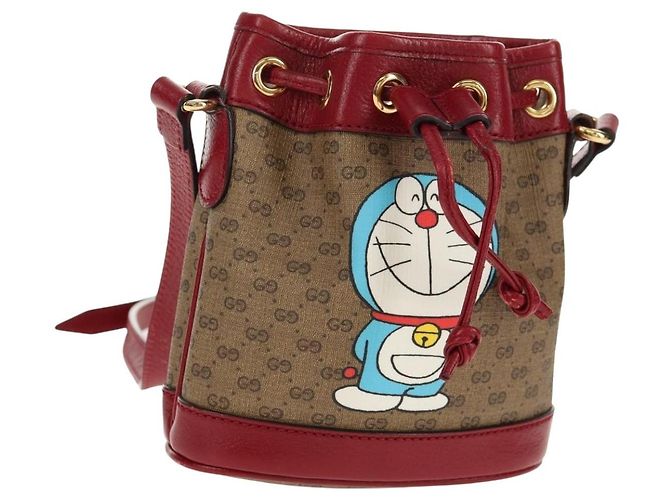 Gucci Mini Bucket Bag Doraemon Micro GG Supreme aus PVC Beige 647801 Auth 157883SM Golden