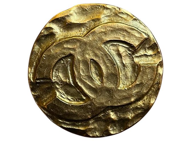 Broche CC dorada Chanel