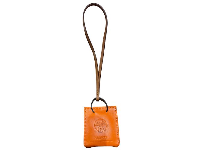 Hermès Mini charme Laranja Hermes em couro laranja e marrom