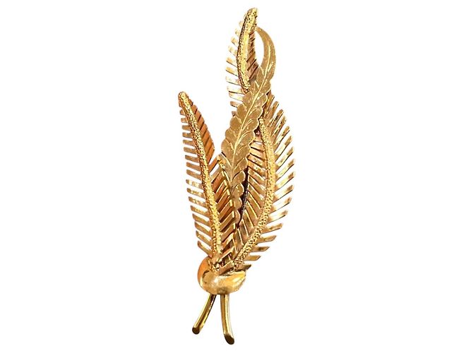 Autre Marque Broche "branche de palmier" en or jaune 18K, avec or ciselé et texturé.