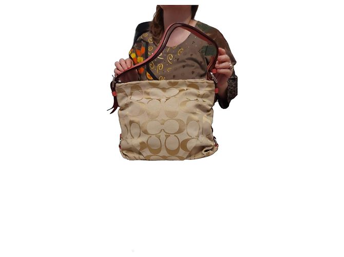 Borsa Coach in tela monogram beige e pelle rosa