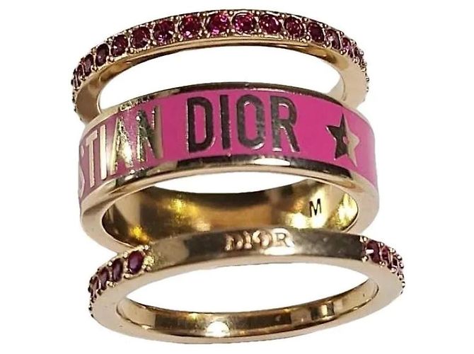 Conjunto de 3 anéis Dior em metal dourado com esmalte branco e cristais prateados Rosa