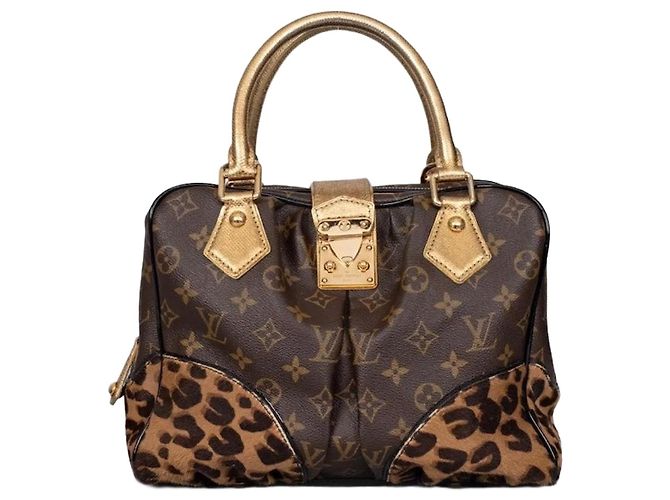 Bolsa tote em lona e couro Louis Vuitton Adele chique usada