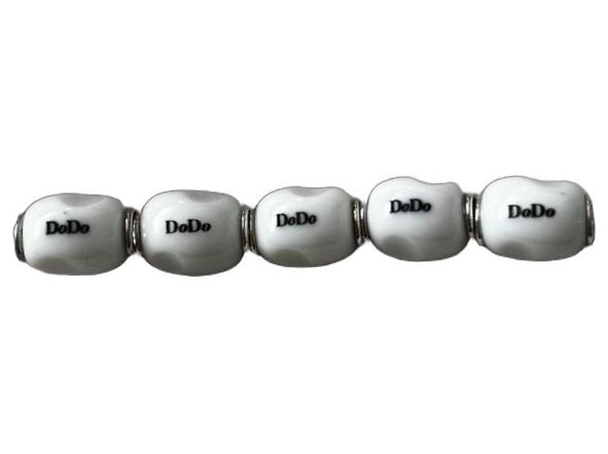 Dodo Pomellato Set di 5 charm / pepite Dodo in argento ed email bianco Silver hardware