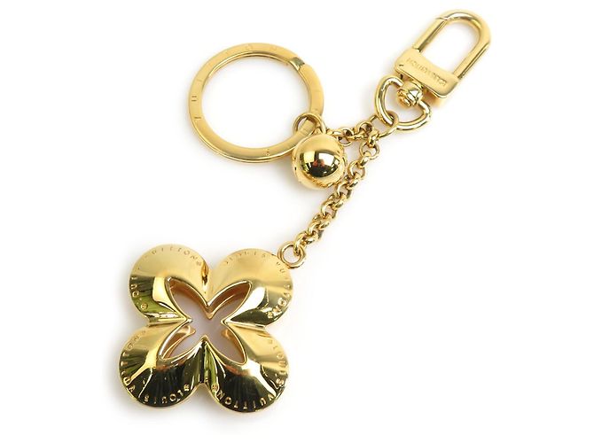 Charm de bolsa dourada Louis Vuitton Dourado