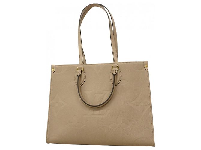Bolso tote OnTheGo MM en Monogram Empreinte Louis Vuitton Beige
