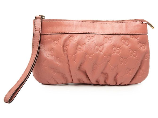Clutch de muñeca Guccissima rosa Gucci