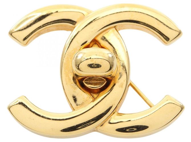 Broche banhada a ouro Chanel Coco Mark Dourado