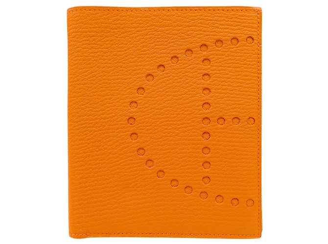 Billetera bi-fold compacta Evelyne de Hermès en naranja