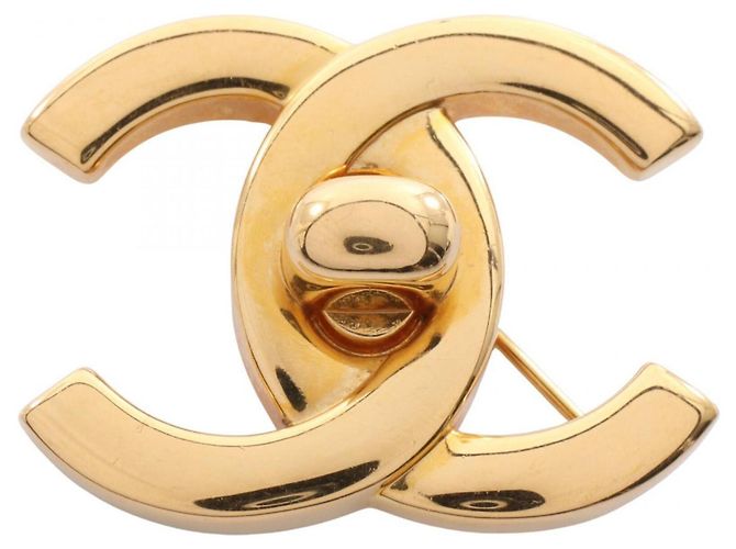 Broche Motivo Turnlock Coco Mark de Chanel Dorado