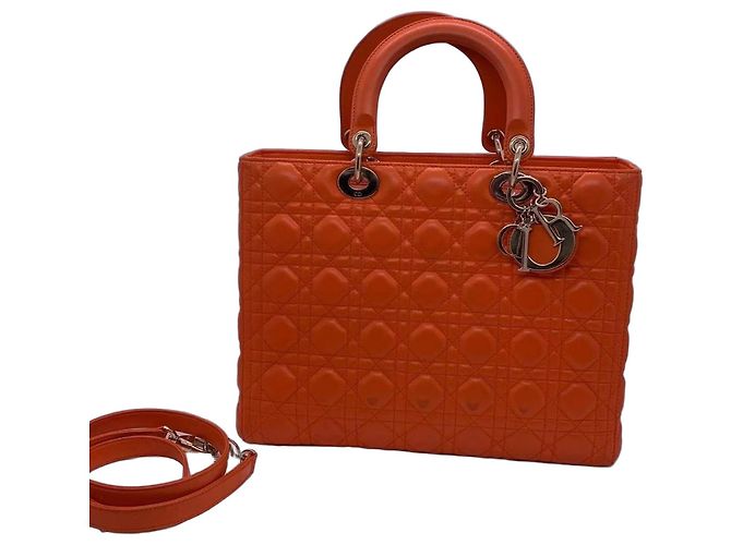 Sac à main Dior Duchess en daim orange avec fermoirs dorés