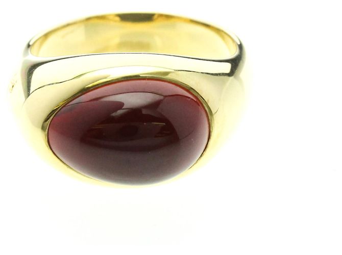 Anillo de banda de oro amarillo de 18K con granate Pomellato Dorado