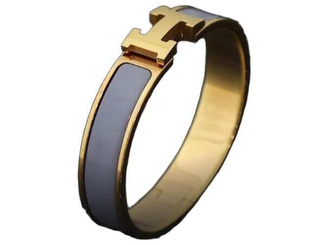 Hermès Clique Asha PM Dourado Verde Macadam