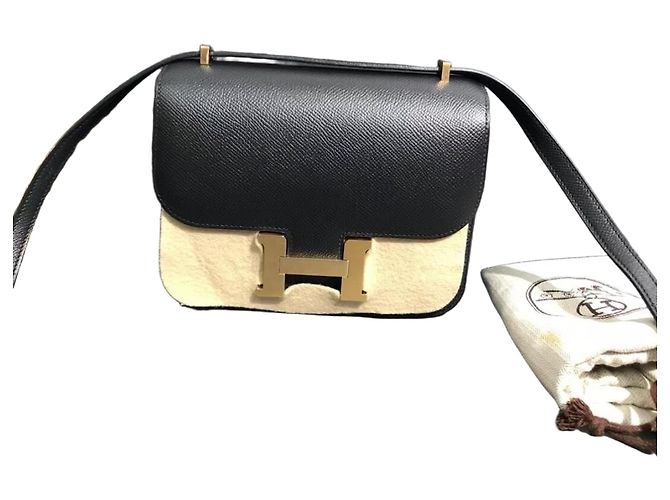 Hermès Constance 19 Uhr Schwarzes und Goldenes Epsom Leder