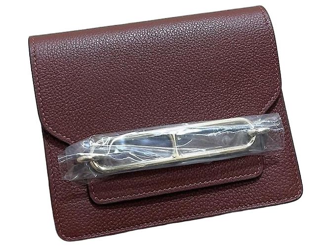 Cartera Hermès Roulis Slim en cuero rojo Roja