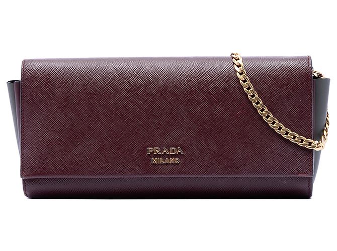 Clutch Bibliotheque em Saffiano vermelho e couro City da Prada com corrente Bordeaux