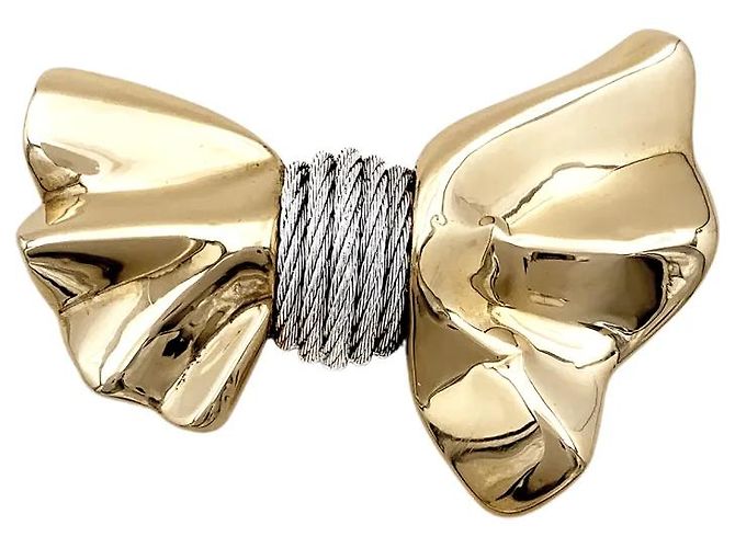 Broche Fred "Nœud", ouro amarelo e aço.