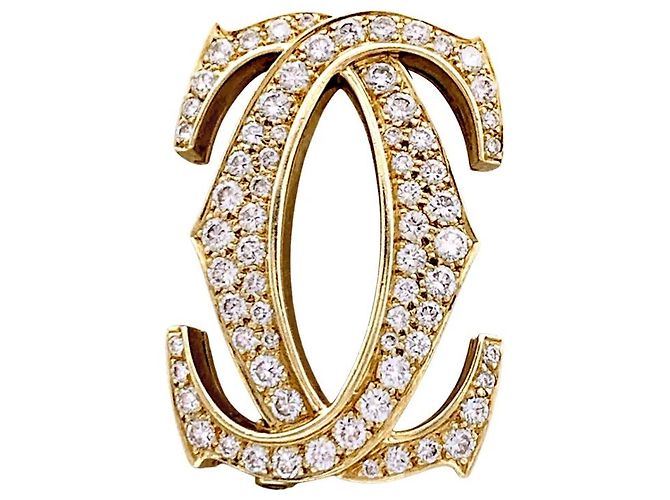 Spilla Cartier, "Double C", oro giallo, diamanti.