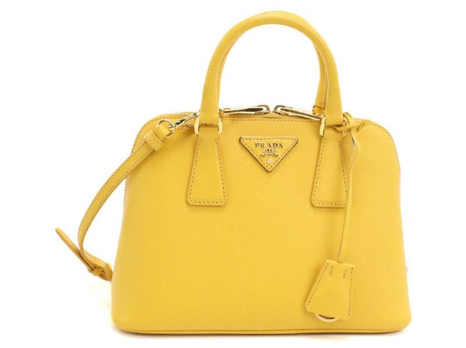 Mini bolsa Prada em couro Saffiano amarelo