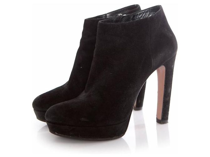 Prada, black suede platform boots.