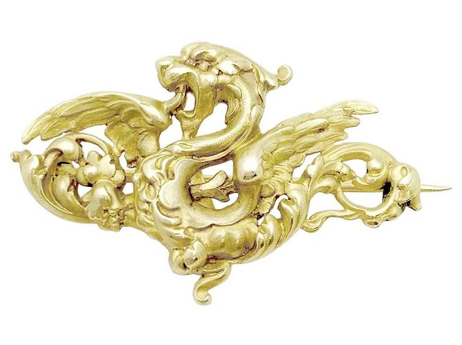 Autre Marque Broche Chimera en oro amarillo.