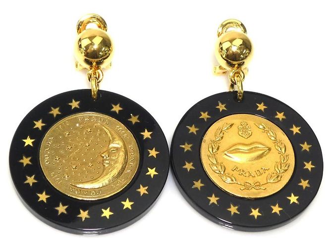 Boucles d'oreilles à clip noires et dorées Prada