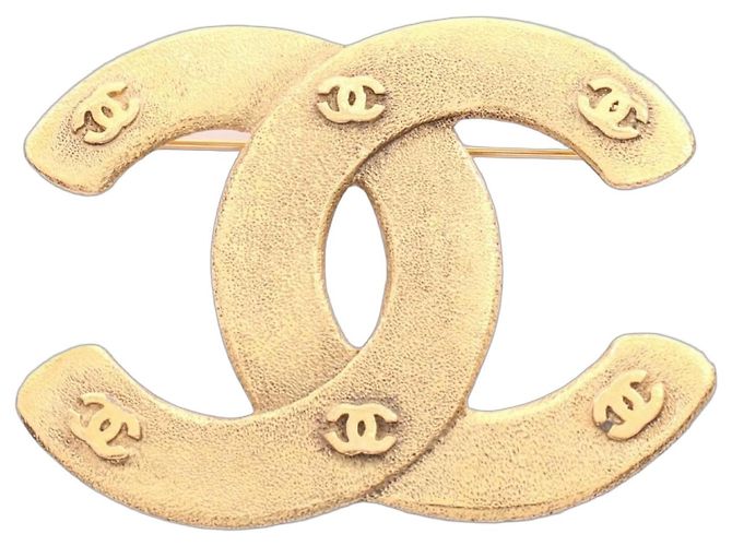 Broche Chanel Coco Mark chapado en oro Dorado